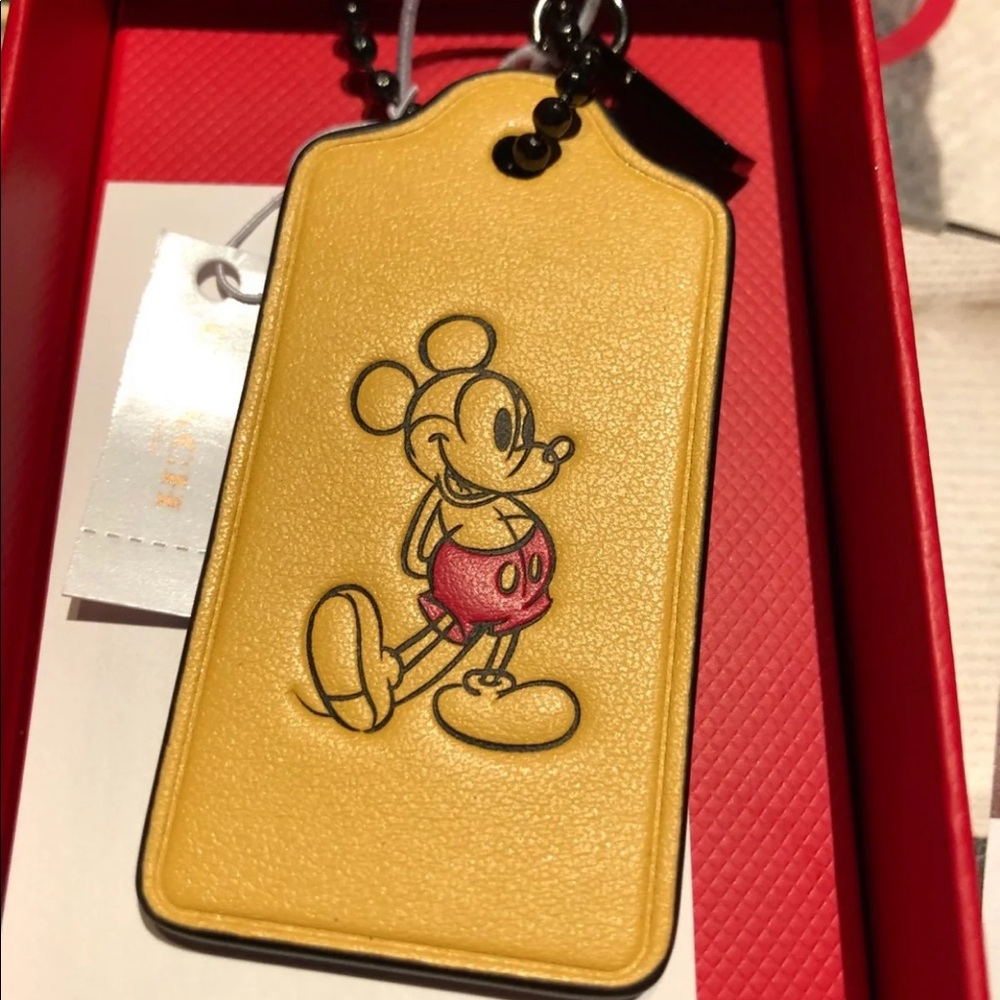 coach yellow Mickey mouse hangtag
